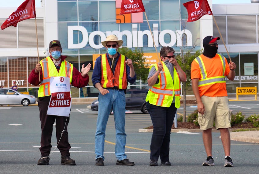 Striking Dominion workers outside the location on Blackmarsh Road in St. John’s. – Andrew Waterman/The Telegram