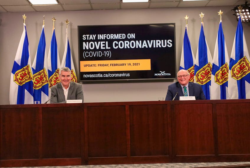 Premier Stephen McNeil and Dr. Robert Strang, Nova Scotia's chief medical officer of health, at a COVID-19 news briefing in Halifax on Friday.