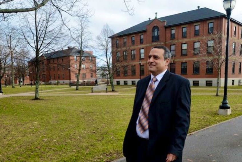 <div class="small-image">
<p>UPEI president Alaa Abd-El-Aziz makes his way across campus in this Guardian file photo.</p>
</div>