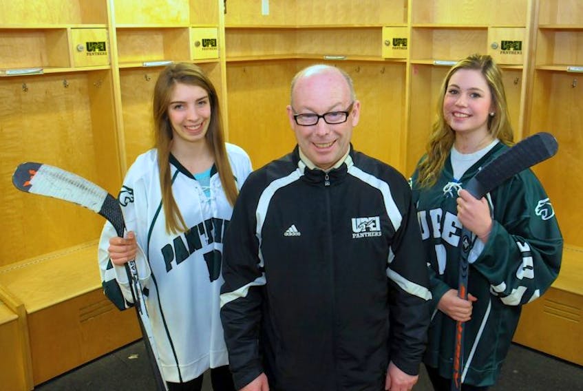 UPEI Panthers women’s hockey coach Bruce Donaldson welcomes new recruits Emma Weatherbie, left, and Cassidy McCabe to the team earlier this week.