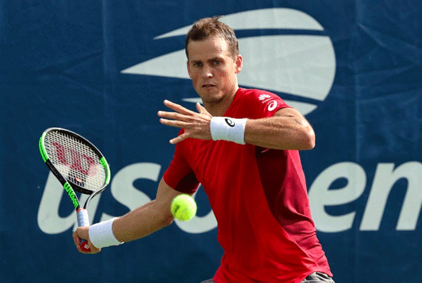  Vasek Pospisil of Canada returns a shot against Karen Khachanov of Russia during their first round match on day two of the 2019 US Open, August 27, 2019.