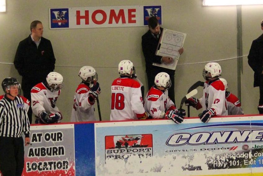 Kohltech Major Midget Valley Wildcats head coach Jeff Kritchew draws up a play as his players look on. CONTRIBUTED