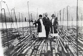 Ivan Bayley with his wife and sister-in-law on the deck of the log raft in Sydney harbour in 1918. Contributed • 77-374-508, Beaton Institute, CBU