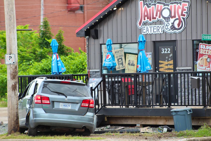A Dodge Journey SUV crashed into the front steps of the Jailhouse Eatery on George Street in Sydney on Monday evening. The driver of the vehicle fled the scene shortly before a Cape Breton Regional Police car arrived and an officer pursued the driver on foot. CAPE BRETON POST