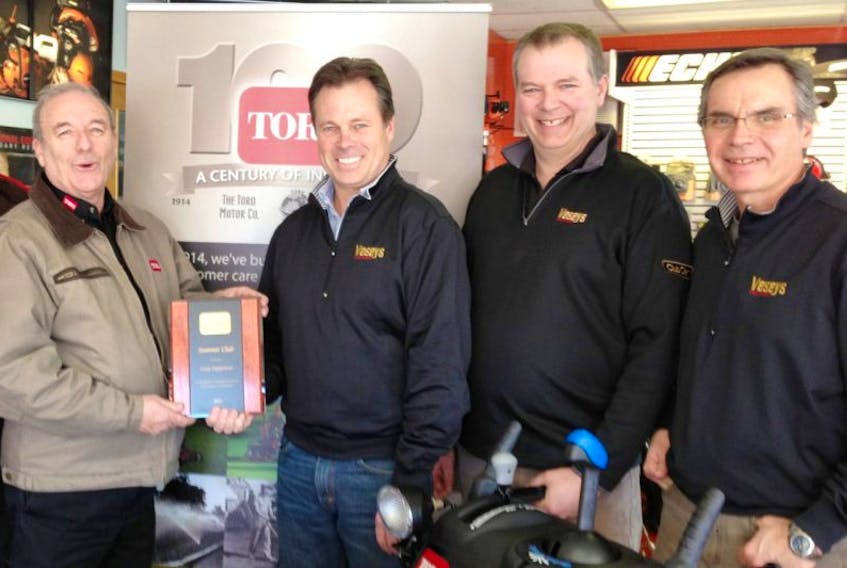 <span>Maurice Bourgeois, left, of the Toro Company presents the Toro Summit Club Award to Scott Nicholson, director, Veseys Equipment. Also on hand are Mike Abbey, right, retail sales manager, and Gary Bryant, sales.<br /></span>