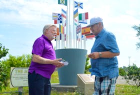 CBRM District 12 councillor Jim MacLeod chats with South Bar resident Guido Vaninetti in front of the Melting Pot monument in Whitney Pier area on Wednesday morning. The 80-year-old MacLeod has announced he will not seek re-election in the Oct. 17 municipal election. DAVID JALA/CAPE BRETON POST