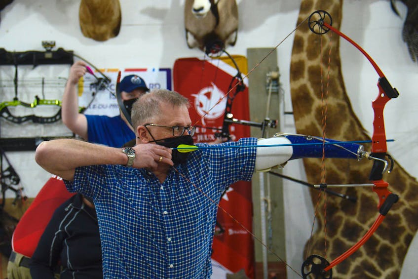 Charlottetown resident Leslie MacDonald aims an arrow at the target.