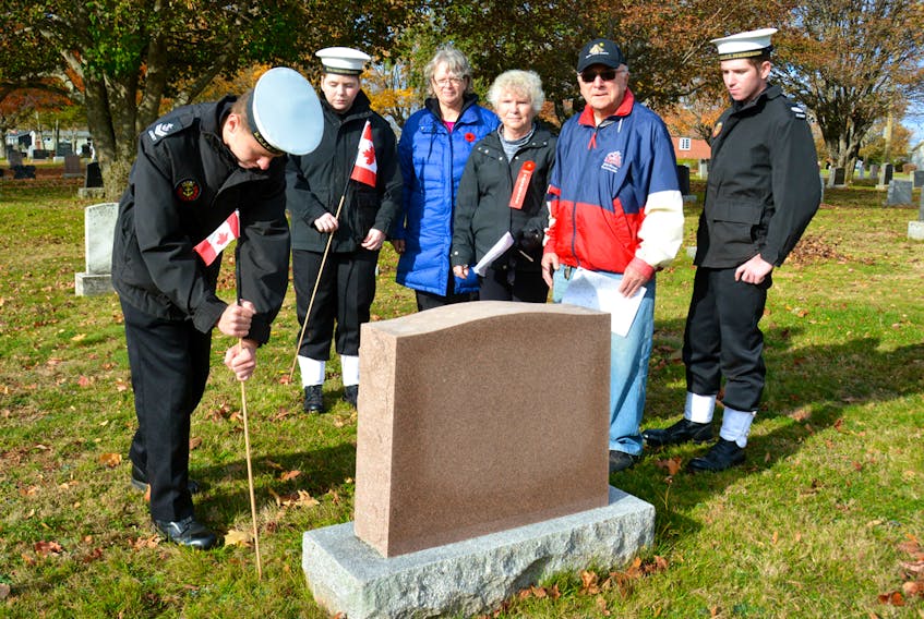 Master Seaman Aiden Little, placing the flag, Petty Officer Effie Ford, Lt. (N) Linda DesRoches, the Commanding Officer of the Summerside Sea Cadets, Gayle Mueller, Roy Crozier, and Petty Officer Second Class Jessie Ford. DESIREE ANSTEY/JOURNAL PIONEER