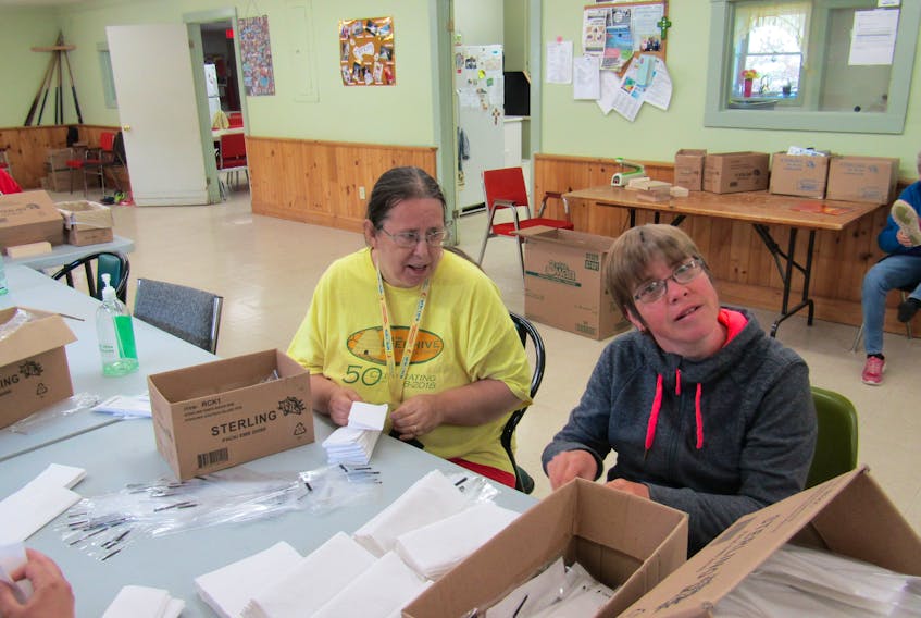 Karen Darh, left, and Tara Burke work on some of the contracted work done at the Beehive Adult Service Centre in Aylesford.