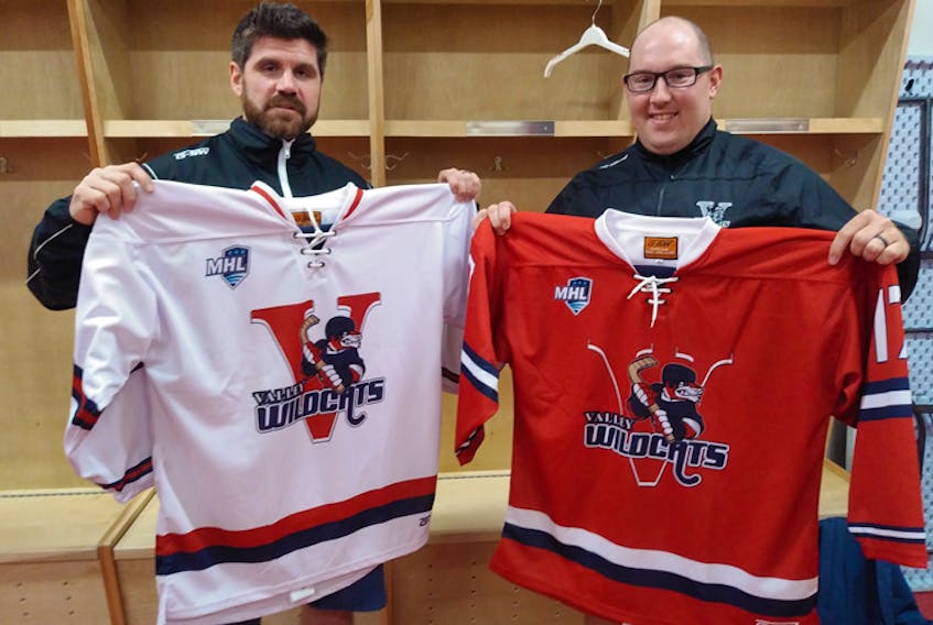 Valley Wildcats head coach Brandon Benedict, left, and assistant coach Nick Croft show off the new jerseys for the Junior A club.