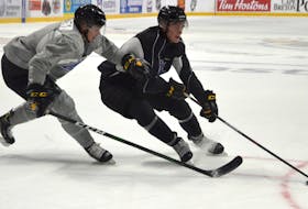 Veteran players Liam Kidney, left, and Cole Fraser battle for position during Cape Breton Eagles training camp at Centre 200 on Monday. Both players were noticeable, like most returning players, throughout the practice. JEREMY FRASER/CAPE BRETON POST