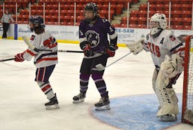 Allison Gilfoy of the Cape Breton Lynx, middle, stands in front of the net during Maritime Major Female Hockey League exhibition action at the Membertou Sport and Wellness Centre last week. Gilfoy will be one of nine returning players on this year’s team when the season begins today. JEREMY FRASER • CAPE BRETON POST