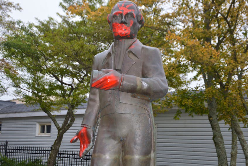 The statue of Joseph Frederick Wallet DesBarres at the corner of Dorchester Street and the Esplanade is shown spray painted Monday morning. The vandalism is believed to have happened sometime between Friday and Monday. It’s unknown who committed the vandalism or why it was done. CAPE BRETON POST STAFF