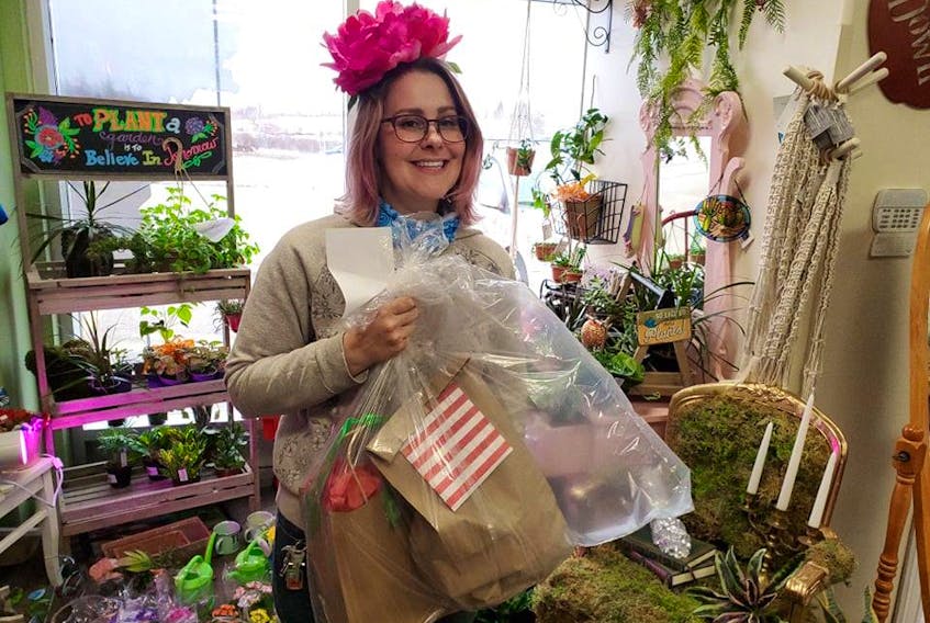 Craft and flower ideas for those at home at Easter and all around have become a specialty at Family HeirBlooms Flowers and Gifts. Katie Hodder, the lead floral designer and co-owner, is shown. CONTRIBUTED