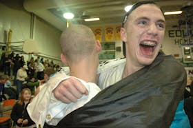 Jonathan MacDonald of the Breton Education Centre Bears, right, celebrates with teammate Adam Wilton moments after the team won its first Coal Bowl Classic title in the tournament's 28-year history in 2009. TJ COLELLO • CAPE BRETON POST