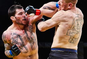 Steven MacDonald of New Waterford, left, lands a punch to the face of William Carriere during the light-heavyweight championship bout of Xcessive Force Fighting Championship in Grand Prairie, Alta., in March 2019. MacDonald won the fight and recently signed a multi-year, multi-fight contract with Bellator MMA, a professional mixed martial arts promotion. ROB TRUDEAU PHOTO
