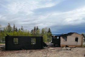 Two cottages belonging to Kirk Whalen and Kelley Doyle were destroyed by fire on May 26 in West Lake Ainslie. The couple were planning to use the cottages for rentals under the name Cape Breton Lake Cottages. PHOTO SUBMITTED/KELLEY DOYLE