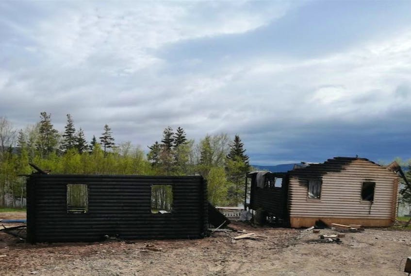 Two cottages belonging to Kirk Whalen and Kelley Doyle were destroyed by fire on May 26 in West Lake Ainslie. The couple were planning to use the cottages for rentals under the name Cape Breton Lake Cottages. PHOTO SUBMITTED/KELLEY DOYLE
