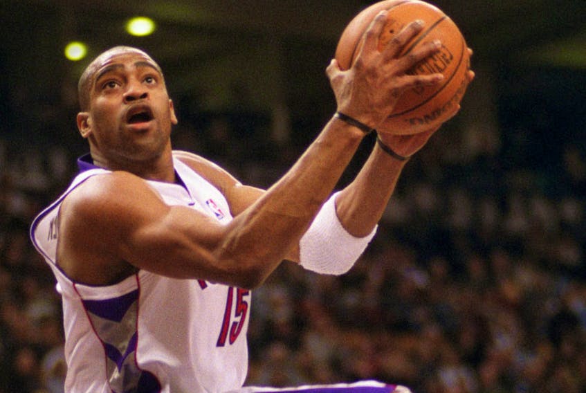 Toronto Raprtors' Vince Carter scores on 360° after a steal from Sacramento Kings' Vlade Divac (background), during the 2001 season. Toronto Sun/files