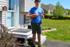 Zachary Fraser, 18, stands outside his Sydney home on June 10 with his ukulele — one of the many instruments the Sydney Academy student plays. He and his friends David Cassagrande and Nathan Grosset, who both attended Riverview High School, are organizing a virtual concert featuring graduating students in the Cape Breton Regional-Victoria Centre for Education. NICOLE SULLIVAN/CAPE BRETON POST