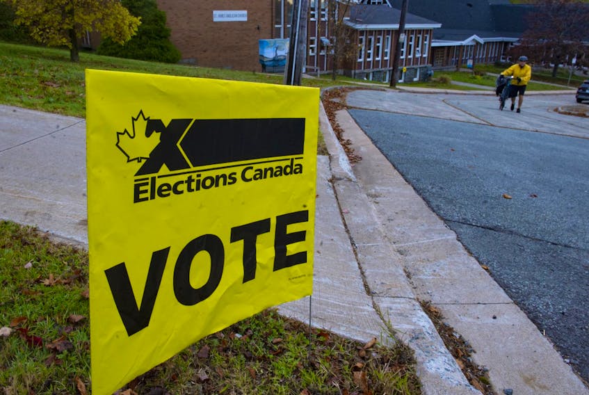 A sign points voters to the polling station at St. James Anglican Church on Joseph Howe Drive in Halifax on Monday, Oct. 21, 2019.
