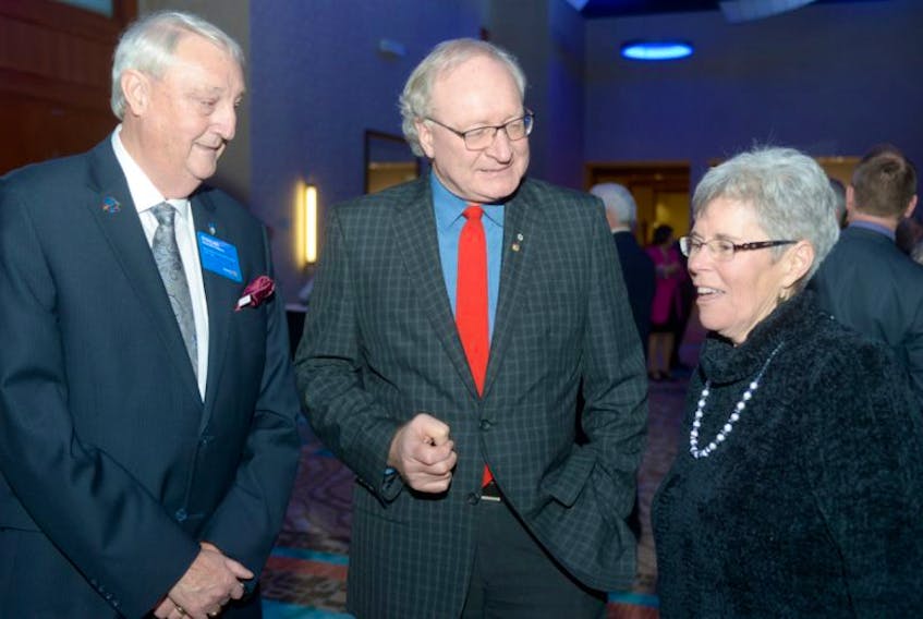 ['<p>Premier Wade MacLauchlan, centre, had a chance to visit with former governor for Rotary District 7820 Duncan Conrad, left, and Charlottetown Rotary member Anne Gillis before delivering his state of the province address at the Delta Prince Edward last night.</p>']