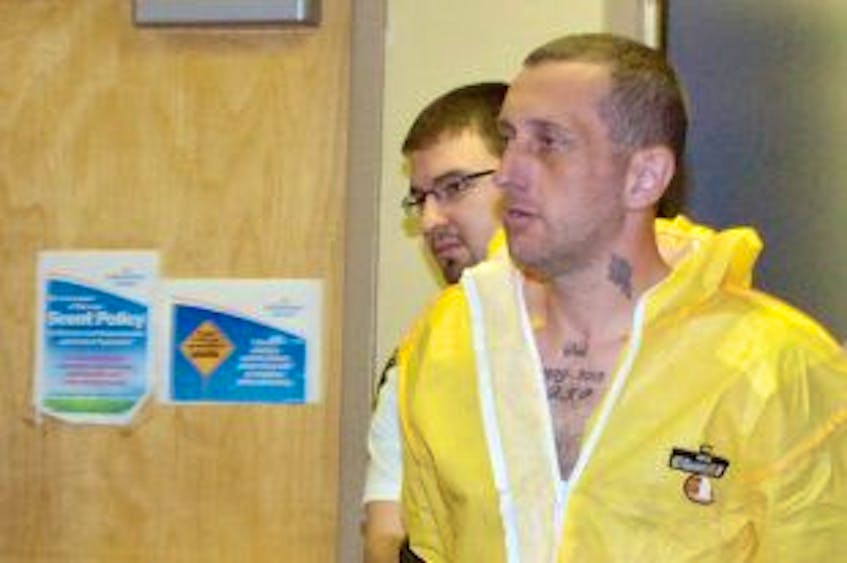 ["Walter Frederick Howell is led out of provincial court in St. John's&nbsp; after he had a charge of attempted murder added to the list of charges he's already facing in connection with an incident that happened on Rickett's Road on May 4. <br /><br />"]