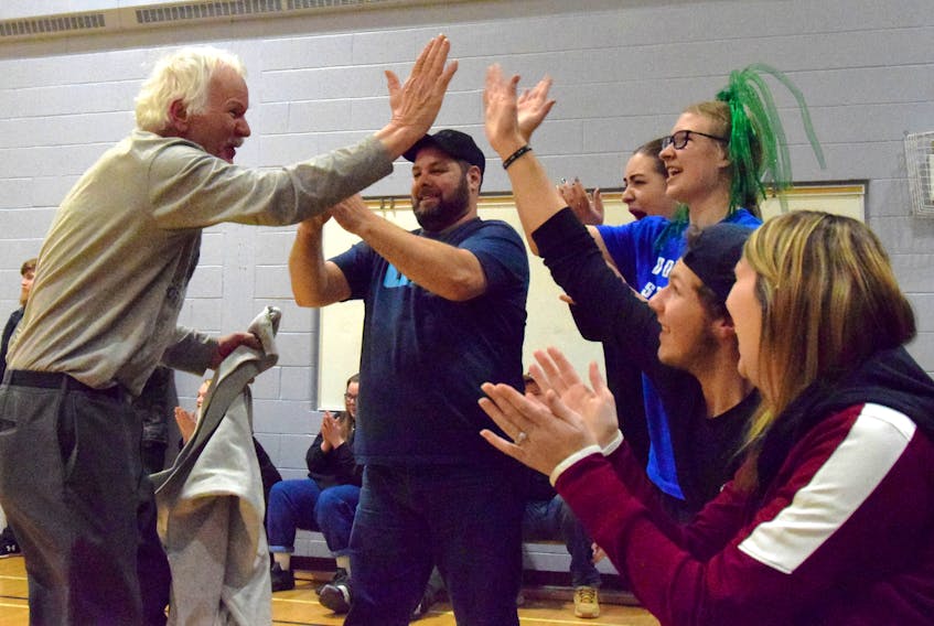 Walter Nickerson celebrates with fellow fans and parents when the Lockeport Greenwave senior girls’ team won the NSSAF Division 3 regional championships on Feb. 22 in Shelburne. KATHY JOHNSON
