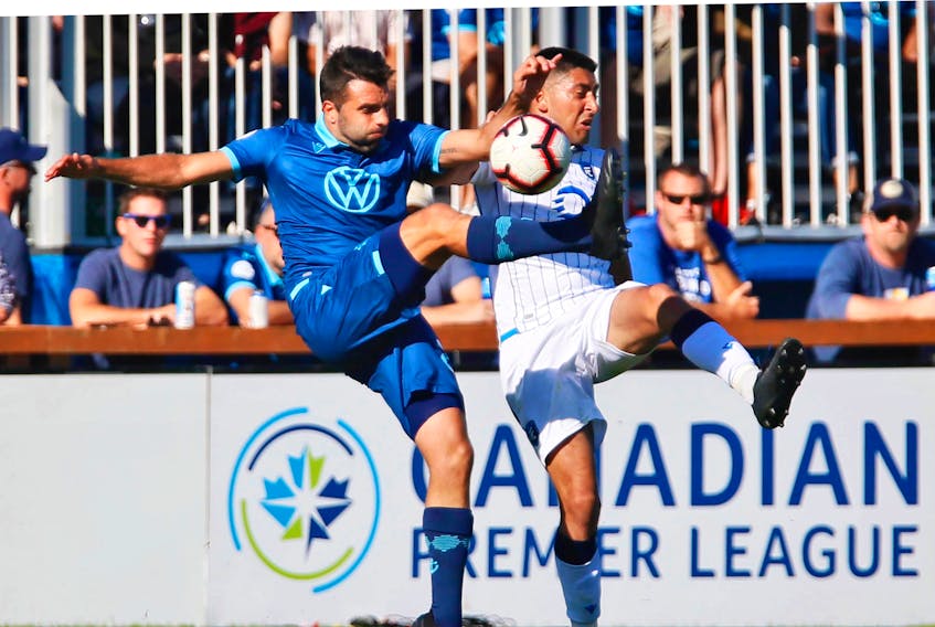 HFX Wanderers FC defender Alex De Carolis, left and FC Edmonton’s Ajeej Sarkaria battle for the ball during last Saturday's Canadian Premier League match at the Wanderers Grounds. TIM KROCHAK / The Chronicle Herald