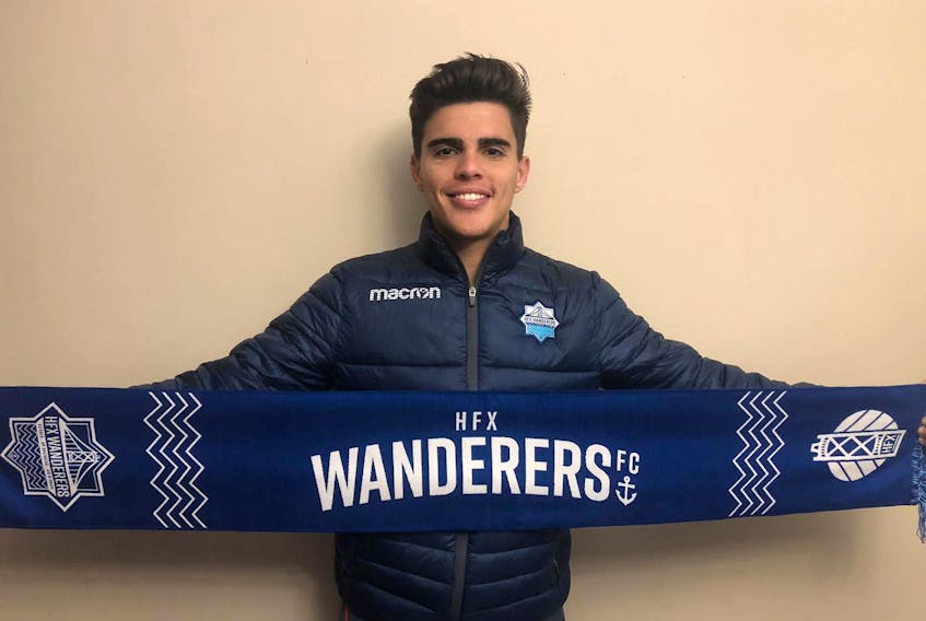 Defender Mateo Restrepo holds up a Halifax Wanderers FC scarf. (CONTRIBUTED)