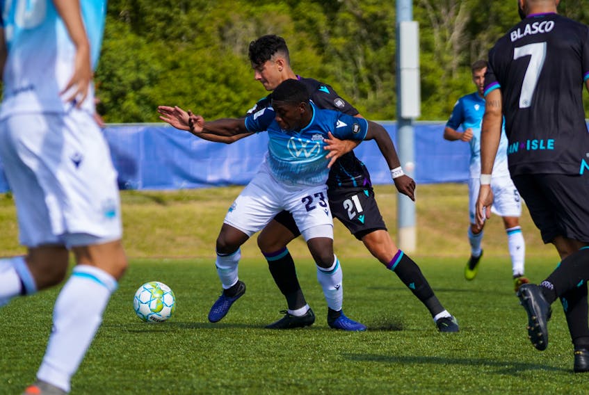 HFX Wanderers FC striker Cory Bent fends off Pacific FC defender Alessandro Hojarbrpour during Saturday’s Canadian Premier League game in Charlottetown. (Canadian Premier League)