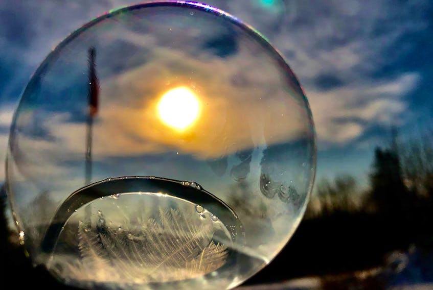 After creating this icy masterpiece, 13-year-old Connor Bourgeois of Howie Center, NS took this incredible photo.  Connor has a love for picture taking - specifically nature pictures and doing experiments - so this was the perfect combination.