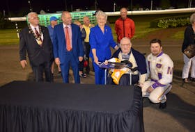 P.E.I. Lt.-Gov. Antoinette Perry presents the 2020 Governor’s Plate to winning owner Walter Simmons. Bugsy Maguire won the $25,000 race, presented by Summerside Chrysler Dodge, in 1:54.1 at Red Shores at Summerside Raceway on Saturday night. Also participating in the presentation are, from left, Summerside Mayor Basil Stewart, Warren Ellis of Summerside Chrysler Dodge and winning driver Brodie MacPhee.