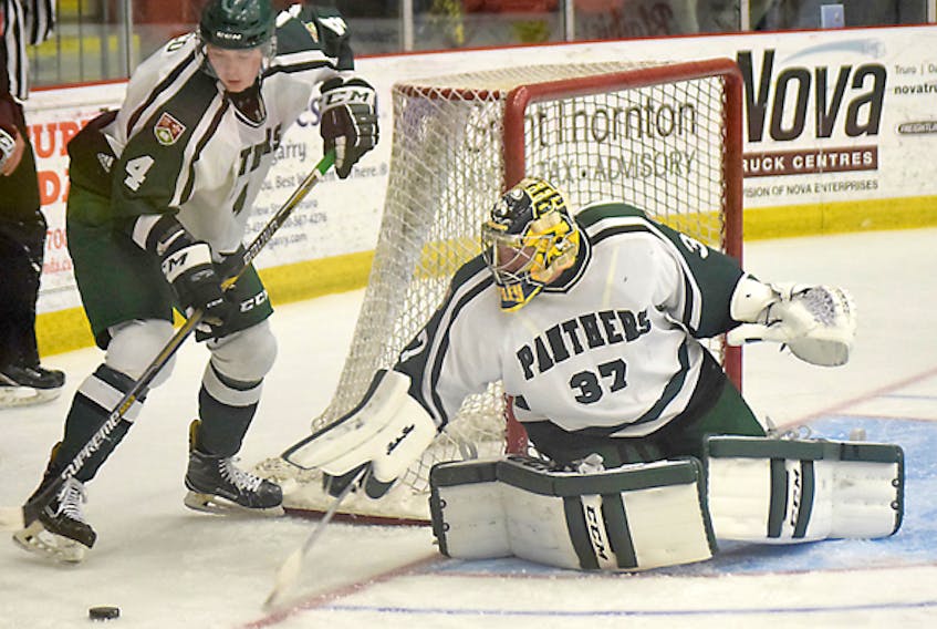 UPEI Panthers goaltender Simon Hofley steers the puck to defenceman Andrew Picco during the second period of an AUS exhibition game against the Saint Mary’s Huskies on Wednesday in Truro.