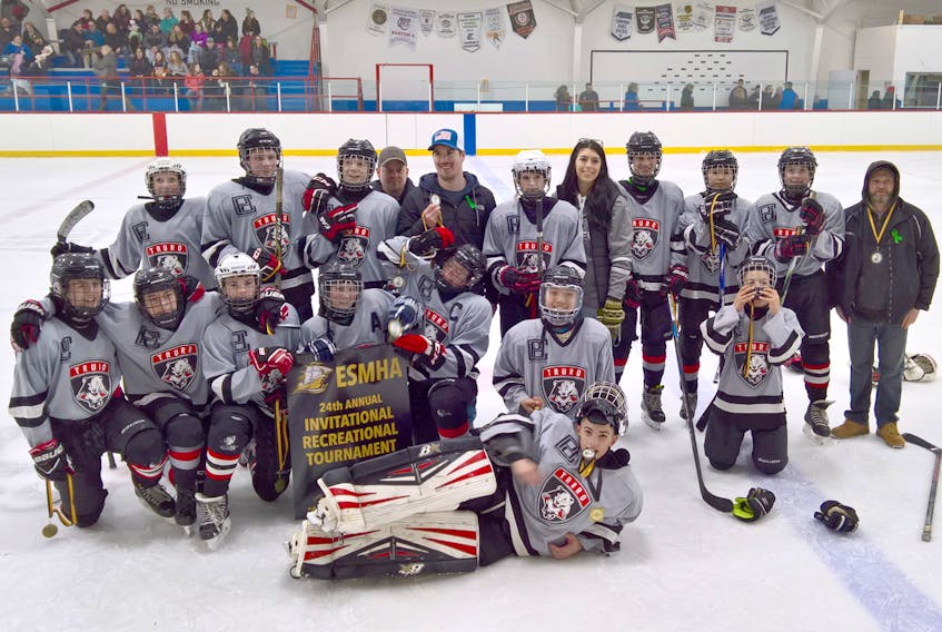Members of the champion Bearcats are, front, Evander Johnson; second row, from left, Nathan Williams, Connor Williams, Ben Davis, Riley Archibald, Johnny Kudluk, and Xavier Oderkirk; third row, Ian Cotterill, Chase Upham, Connor LaBonte, assistant coach Clayton Williams, assistant coach Riley Simms, Kayden McKay, head coach Bailee Oderkirk, Tyler Foley-MacKenzie, Herriet Kudluk, Ethan Martin and assistant coach Kory Davis. Absent is assistant coach Jeff Oderkirk.