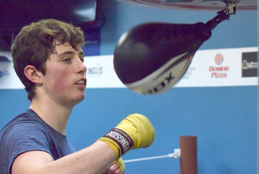 J.T. Thomson works out in the speed bag during training this week at Beyond Boxing Fitness Studio. Thomson, a 17-year-old from Truro, will fight on Friday when the local club hosts its first card at the Best Western Glengarry.