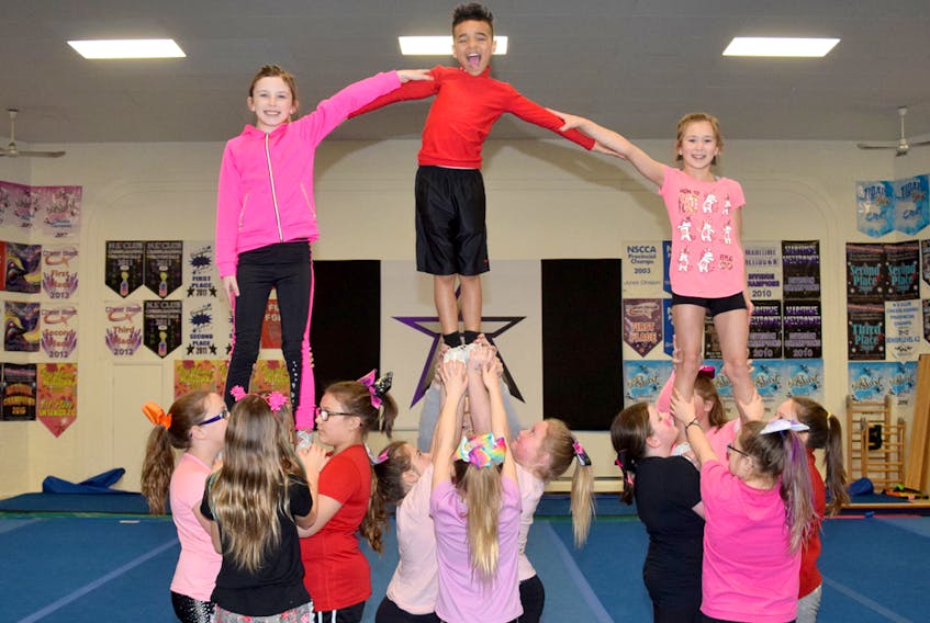 Members of the Heatwave youth team practise in preparation of the Central Nova Cheer Challenge this weekend at the RECC. More than 1,500 athletes will pour into the Hubtown for the two-day competition, which gets underway Saturday.