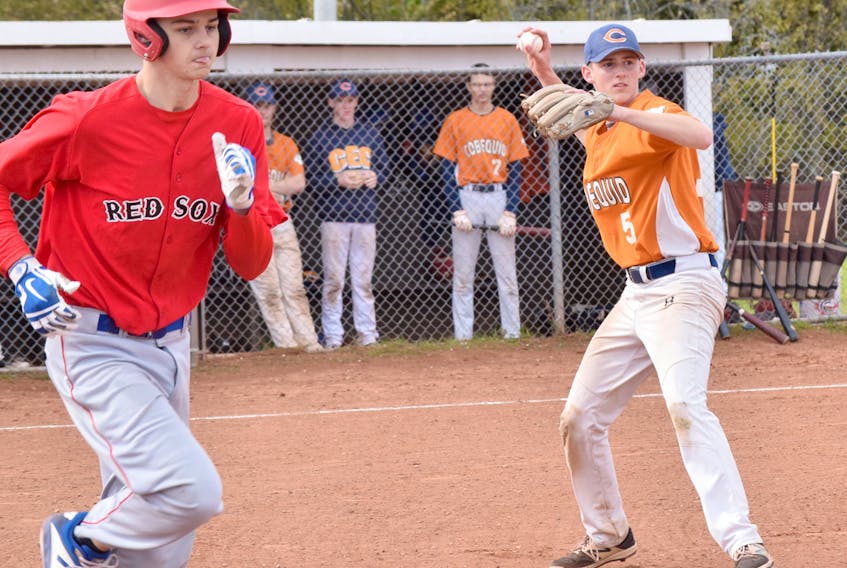 CEC pitcher Quinn Cashen fields the ball and makes a throw to first base for the out during NSSAF wildcard baseball action on Thursday in Truro.