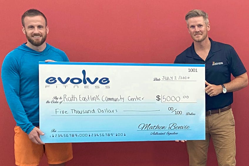 Mathew Benvie, left, of Evolve Fitness, contributed $5,000 to the RECC L.I.F.E program as part of its new virtual fitness partnership with the Truro facility. Accepting the contribution is RECC general manager Matt Moore.