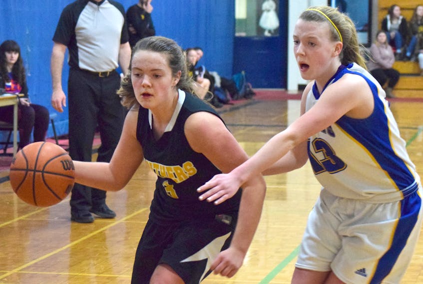 Jewel Woolfitt of the Truro Panthers drives on Dara McCabe of Stone Park, P.E.I., during action on Friday at the CEC Leadership junior girls basketball tournament.