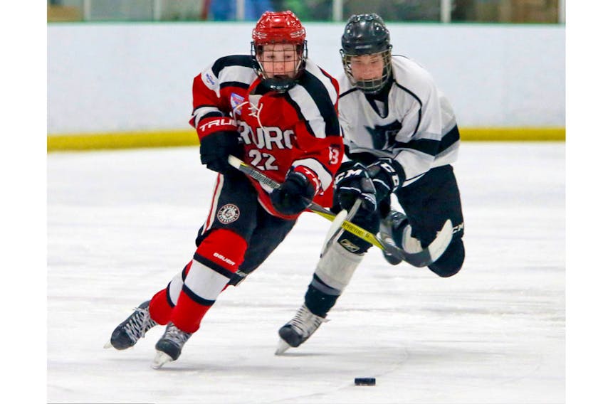Truro Bearcats Brandon Forbes heads up ice as Tri-Pen Ice’s Gavin Pitcher gives chase during major bantam action at the BMO Centre Wednesday.