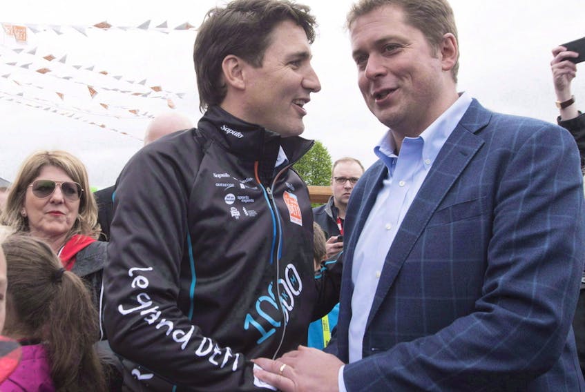 Prime Minister Justin Trudeau, shakes hands with Conservative Leader Andrew Scheer Thursday, June 14, 2018 in Saguenay Que. 