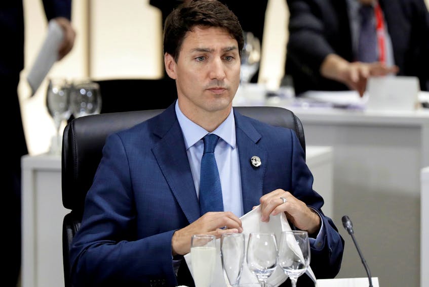 FILE PHOTO: Canada's Prime Minister Justin Trudeau attends a working lunch at the G-20 summit in Osaka, Japan, on Friday, June 28, 2019. 
