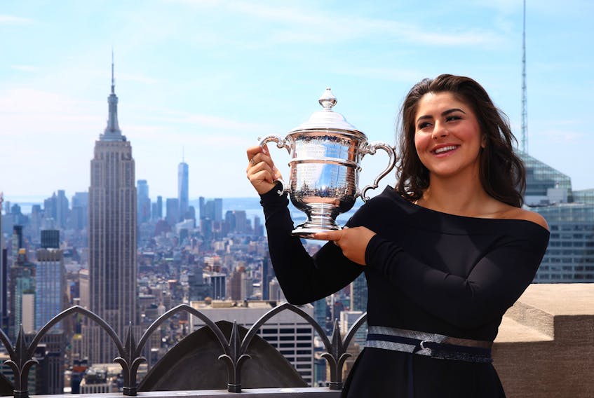 Bianca Andreescu of Canada poses with her trophy at the Top of the Rock in Rockefeller Center on September 8, 2019 in New York City.