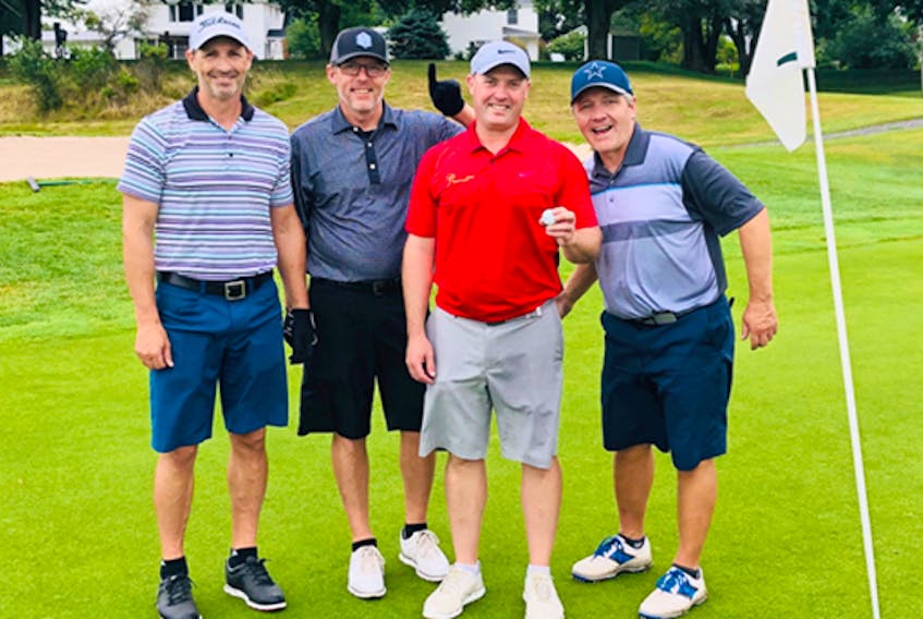 Craig White made a hole-in-one at Truro Golf Club while playing with, from left, Jay Foster, Brian Hayden and Scott Cameron.