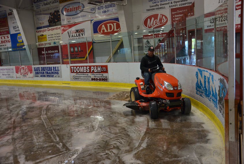 Kensington Credit Union Centre manager Robert Wood cleans the ice surface on Tuesday morning. The ice had to be removed following a power outage from Hurricane Dorian and will be reinstalled later this week.