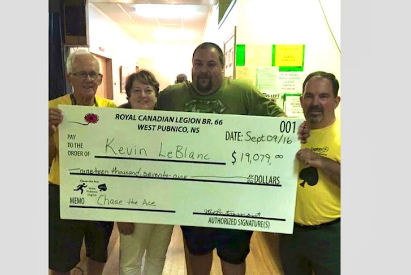 West Pubnico Legion Chase the Ace committee members Jean Bernard d’Entremont, Charlene LeBlanc and Glenn Diggdon present the Sept. 9 Chase the Ace night’s winnings to Kevin LeBlanc.