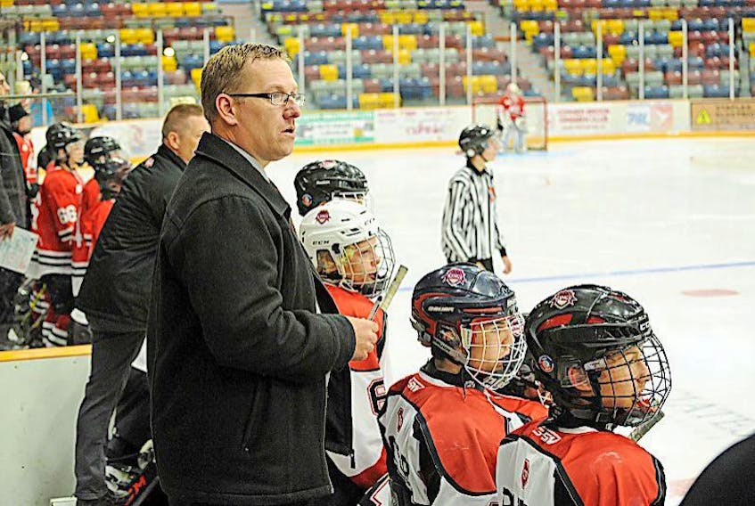 <p>Dave Kearsey/The Western Star</p>
<p>Western Kings AAA Bantam Kings coach Mark Robinson keeps a close eye on the action from behind the bench.</p>