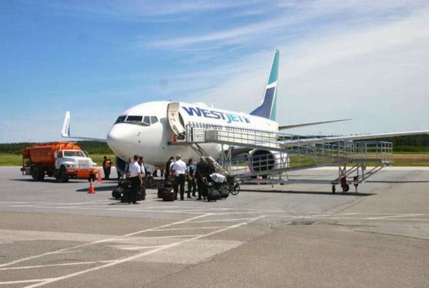 A WestJet aircraft is shown at Deer Lake Regional Airport in this file photo.