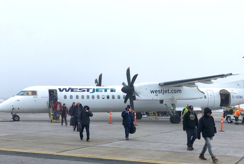 Passengers disembark from a WestJet Encore plane at the JA Douglas McCurdy Sydney Airport at an earlier date. West Jet announced Wednesday they will be resuming flights to four airports in the Atlantic provinces – including Sydney – in June, as well as Quebec City. CONTRIBUTED JA DOUGLAS MCCURDY SYDNEY AIRPORT
